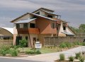 The classic designs of Queenslander style homes and beach shacks are the inspiration for a contemporary Australian coastal style at Casuarina Beach featuring steel roofing made from COLORBOND® steel.