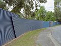 South Australian sculptor Marijana Tadic created a continuous feature wall around Gawler Caravan Park using COLORBOND&reg; steel, both vertically and horizontally, in alternate colours of Mountain Blue and Torres Blue.